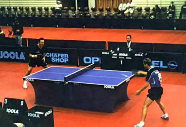 Why do Ping Pong Players Touch Hands on Table?